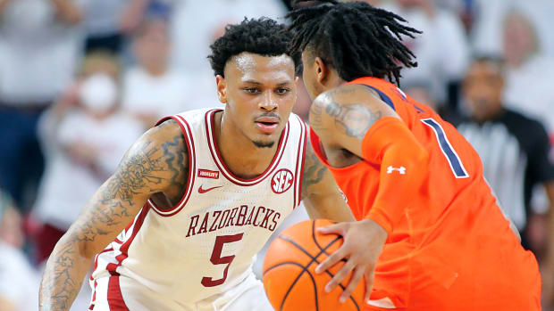 Arkansas Razorbacks guard Au'Diese Toney (5) defends against Auburn Tigers guard Wendell Green Jr. (1) at Bud Walton Arena. Arkansas won 80-76.